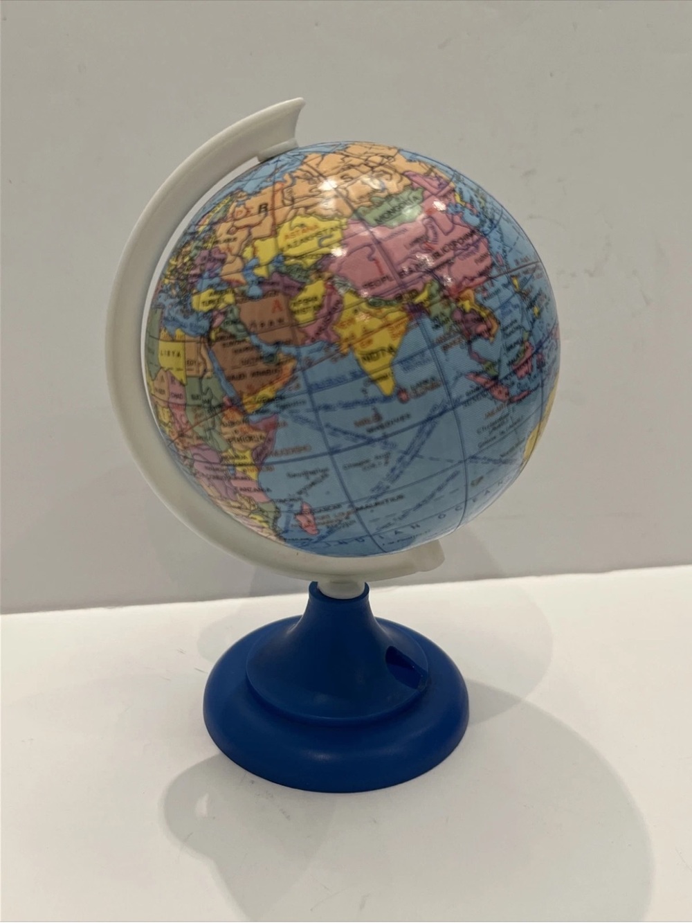 VINTAGE 5.5” High Plastic Globe Pencil Sharpener Blue base.